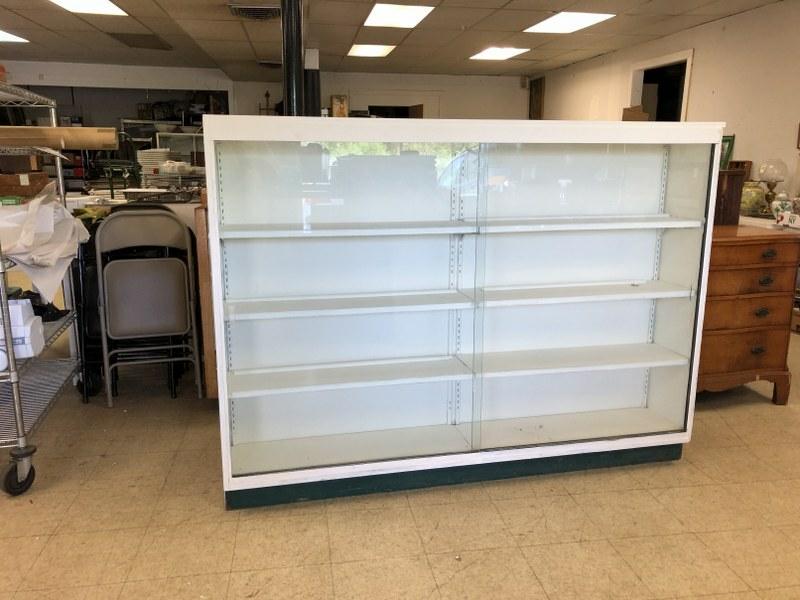 LARGE WHITE PAINTED PLYWOOD WALL SHOWCASE, WITH GLASS: LARGE WHITE PAINTED PLYWOOD WALL SHOWCASE, WITH GLASS SLIDING DOORS AND WOOD SHELVING. FROM CLOSING ANTIQUE CENTER, MEASURES 74" LONG, 54" HIGH X 13" DEEP. IT'S SOLID AND STURDY.