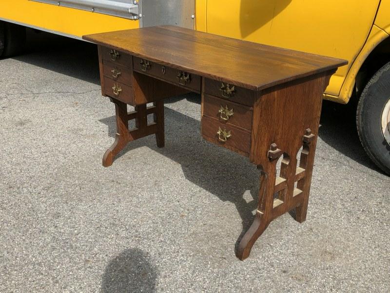 MISSION OAK DESK WITH 7 DRAWERS, MORTIS AND TENON: MISSION OAK DESK WITH 7 DRAWERS, MORTIS AND TENON SIDES, SOMEONE REPLACED ORIGINAL PULLS YEARS AGO, CAN'T SEE MAKERS NAME. SOLID STRUCTURALLY. MEASURES 44.5" WIDE X 22" DEEP X 29" HIGH. CAN'T SEE MAKE