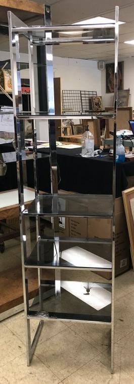 1970'S OR 80'S CHROME GLASS SHELF, WITH SMOKED GLASS: 1970'S OR 80'S CHROME GLASS SHELF, WITH SMOKED GLASS SHELVES, ( 2 SHELVES HAVE CORNER CHIPS OUT OF THEM, STILL FUNCTUAL TO USE. MEASURES 72" HIGH X 19" WIDE X 15" DEEP. FROM LOCAL HOME.