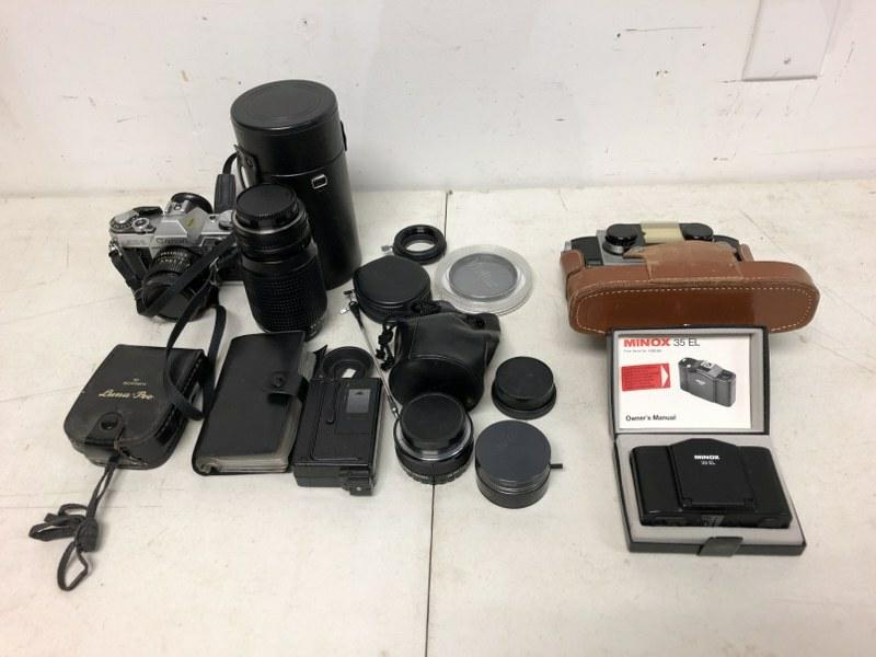 MISC. ESTATE CAMERA LOT WITH CANON AE-1 35 MM, LENSES: MISC. ESTATE CAMERA LOT WITH CANON AE-1 35 MM, LENSES FOR IT, ALSO A REALIST STEREO, MONOX 35 EL, AND SOME ODDS AND ENDS AS PICTURED.