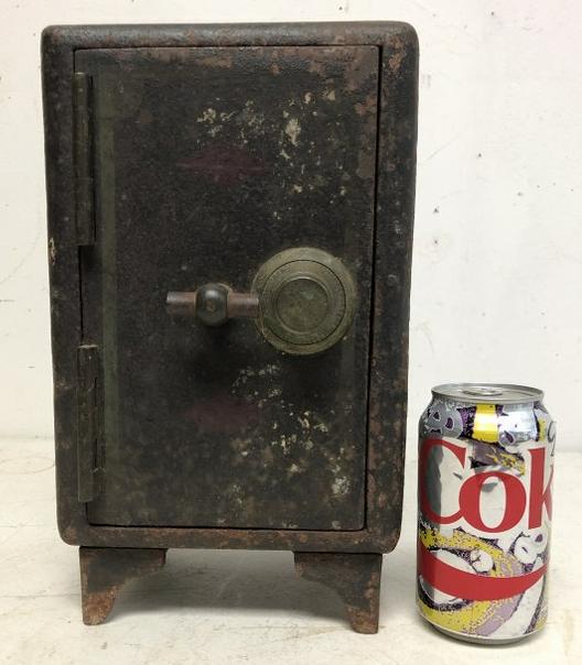 12" HIGH OLD CAST IRON SAFE, FROM LOCAL ESTATE, DO NOT: 12" HIGH OLD CAST IRON SAFE, FROM LOCAL ESTATE, DO NOT HAVE THE COMBINATION, CAN SEE TRACES OF THE OLD PAINT, MEASURES 12" H X 7"WIDE X 6" DEEP.