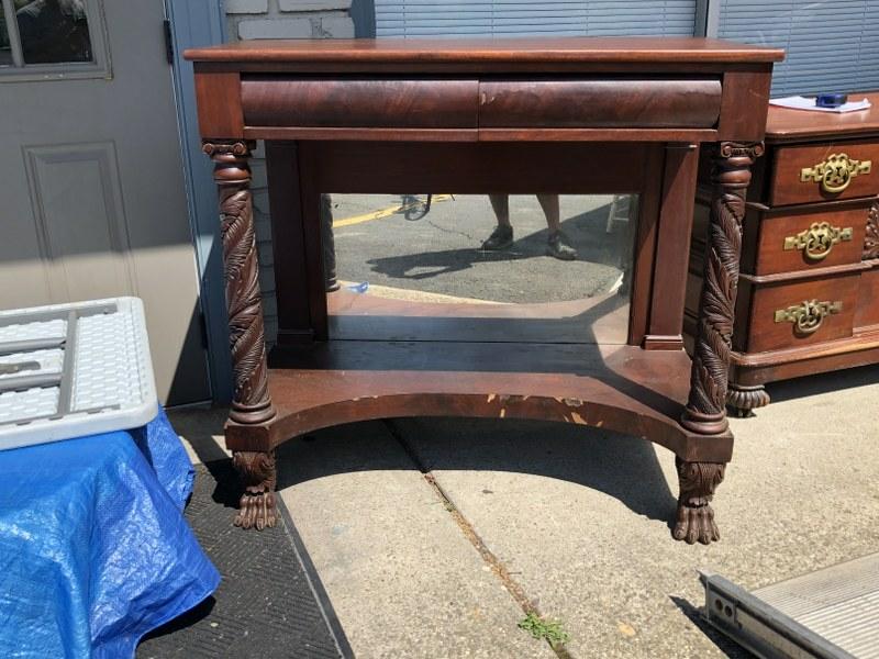 PERIOD MAHOGANY CARVED CLAW FOOT AND COLUMN SERVER,: PERIOD MAHOGANY CARVED CLAW FOOT AND COLUMN SERVER, MIRROR BACK OF BASE, SOME VENEER PIECES OFF, MEASURES 43" X 22" X 41" HIGH. FROM ULSTER COUNTY ESTATE.