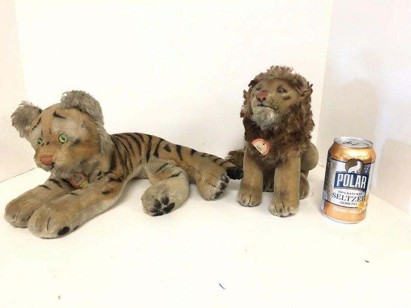 STEIFF VINTAGE TIGER & LION,FROM LOCAL ESTATE, BOTH: STEIFF VINTAGE TIGER & LION,FROM LOCAL ESTATE, BOTH HAVE THEIR CARDBOARD TAGS, THE LION'S IS CUT IN HALF. TIGER MEASURES 19" TO TAIL AND LION IS 9" TALL. OVERALL VERY NICE CONDITION. MISSING BUTTONS I