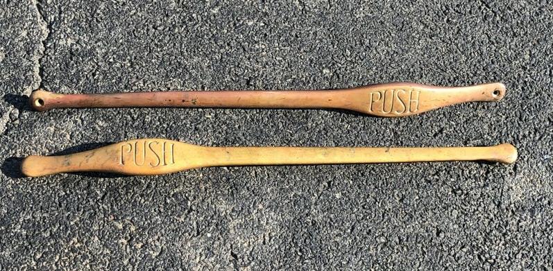 (2) CIRCA 1910 BRONZE OR HEAVY BRASS DOOR "PUSH": (2) CIRCA 1910 BRONZE OR HEAVY BRASS DOOR "PUSH" HANDLES, NICE OLD PATINA, FROM HUDSON VALLEY ESTATE, THEY MEASURE 28.75" LONG, GOOD WEIGHT.