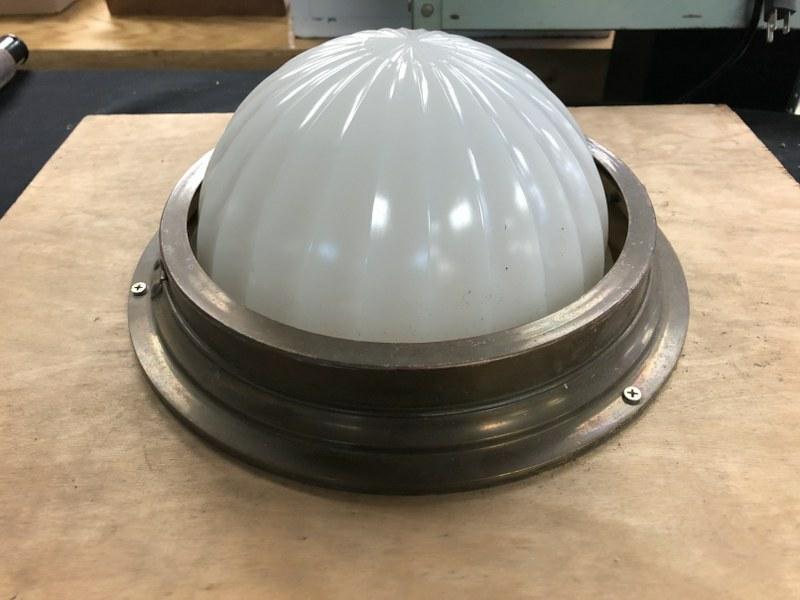 OLDER FLUSH MOUNT BRASS CEILING FIXTURE WITH OFF WHITE: OLDER FLUSH MOUNT BRASS CEILING FIXTURE WITH OFF WHITE GLASS SHADE, NICE ESTATE CONDITION, MEASURES 13" ACROSS.