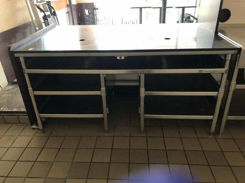 STAINLESS STEEL WORKTABLE WITH SHELVING, BLACK SLATE: STAINLESS STEEL WORKTABLE WITH SHELVING, BLACK SLATE TOP, WAS PART OF STOREFRONT COUNTER. BUYER DISASSEMBLES. MADE BY HOMELAND BUILDERS INC. TOP MEASURES 68" BY 40.5 " BY 34"HIGH. THIS LOCATION IS LOC