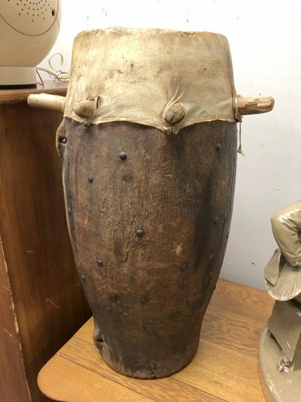 OLDER NATIVE DRUM, ORIGIN UNKNOWN TO ME, GUT OR SIMILAR: OLDER NATIVE DRUM, ORIGIN UNKNOWN TO ME, GUT OR SIMILAR TOP, GOOD CONDITION, FROM ESTATE OF WOMAN WHO TRAVELED, MEASURES 24" HIGH X 11.5" ACROSS.