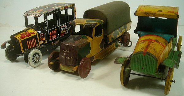 3 OLD TIN VEHICLES MARX JALOPY ENGLAND ARMY ARMY TRUCK : 3 OLD TIN VEHICLES MARX JALOPY ENGLAND ARMY ARMY TRUCK & CHEIN STAKE TRUCK. THE MARX JALOPY & ENGLISH ARMY TRUCK ARE BOTH KEY WINDS. THE MARX IS MISSING A FENDER AND FRONT GRILL, ARMY VEHICLE HAS SOME