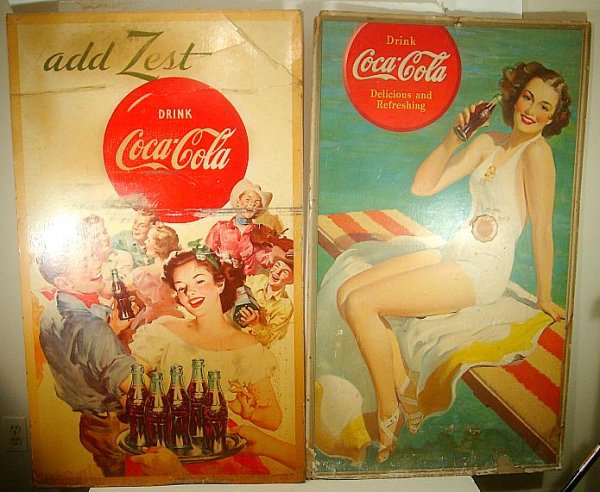 2 LARGE OLD COCA COLA CARDBOARD SIGNS, THEY MEASURE 48": 2 LARGE OLD COCA COLA CARDBOARD SIGNS, THEY MEASURE 48" X 29 1/2" EACH, BOTH IN AS IS CONDITION WITH CARDBOARD LOSS, SCUFFS AND CREASES, AS PICTURED
