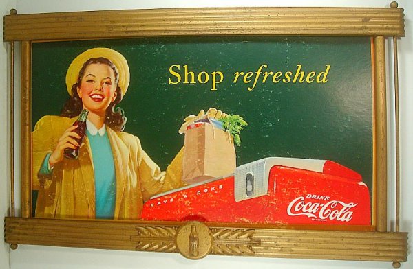 COCA COLA OLD SIGN IN WOOD FRAME, SHOWS GIRL DRINKING C: COCA COLA OLD SIGN IN WOOD FRAME, SHOWS GIRL DRINKING COKE WITH SHOPPING BAG ON COKE COOLER, DATED 1948, HAS SOME SURFACE SCUFFS ON CARDBOARD, SIGN MEASURES 20" X 36", FRAME IN GOOD CONDITION