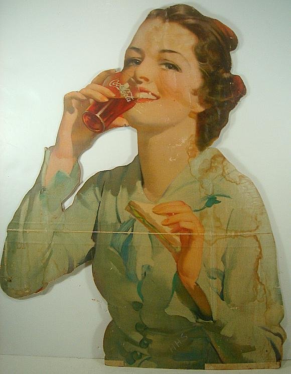 COCA COLA EARLY LITHO SIGN, WOMAN DRINKING COKE FROM GL: COCA COLA EARLY LITHO SIGN, WOMAN DRINKING COKE FROM GLASS, HAS CREASE ACROSS FRONT AND OLD WATER STAINS, MEASURES 36" HIGH X 27" ACROSS