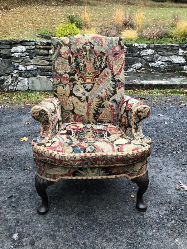QUEEN ANNE CARVED WALNUT WING CHAIR, ENGLISH, MID 18TH: QUEEN ANNE CARVED WALNUT WING CHAIR, ENGLISH, MID 18TH C WITH NEEDLEPOINT TAPESTRY UPHOLSTERY. FROM COLUMBIA COUNTY ESTATE, MEASURES 43" HIGH.