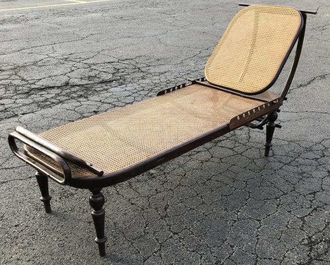 RARE THONET CANED CHAISE, VICTORIAN LEGS, BEAUTY, IN: RARE THONET CANED CHAISE, VICTORIAN LEGS, BEAUTY, IN STORAGE FOR THE LAST 34 YEARS. ADJUSTABLE HEAD REST, 2 SMALL HOLES IN CANE, ONE ON FOOT REST, ONE ON MAIN BODY. LOOKS LIKE SIDE SLATS WHERE ROD GOE