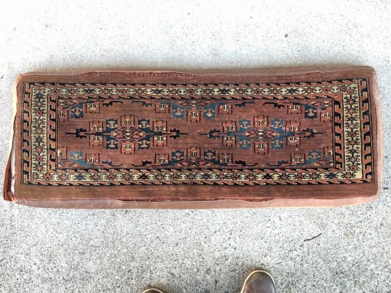 NICE EARLY BENCH CUSHION, ORIENTAL WEAVING, LIKE A RUG,: NICE EARLY BENCH CUSHION, ORIENTAL WEAVING, LIKE A RUG, SIDE MATERIAL SEPARATING, FROM OLD ESTATE IN KINGSTON, N.Y. TOP PART IN VERY NICE CONDITION, MEASURES 40" L X 16" W X 3" THICK. VERY NICE CUSHIO