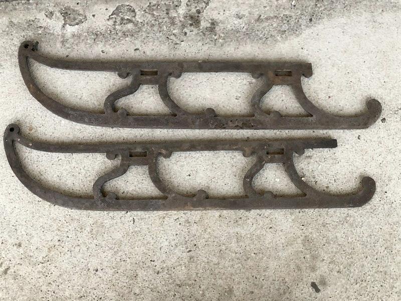 PAIR EARLY CAST IRON SLED RUNNERS, FOUND IN BARN IN: PAIR EARLY CAST IRON SLED RUNNERS, FOUND IN BARN IN MARLBORO, N.Y. GREAT ARCHITECTURAL FORM, AND DESIGN, THICK ( .75") MEASURE 30" LONG X 5.5" HIGH. ONE HAS SMALL PIECE OF BAR OFF, THE RUSTING AND SMA