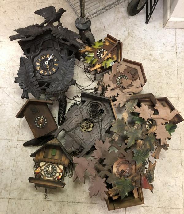 LOT OF AS IS CUCKOO CLOCKS, FROM OLD TIME CLOCK: LOT OF AS IS CUCKOO CLOCKS, FROM OLD TIME CLOCK REPAIRMAN, WHO DID IT ON THE SIDE, AS FOUND CONDITION, FROM HIS WORKBENCHES AND WORK TABLES. NO IN HOUSE SHIPPING.