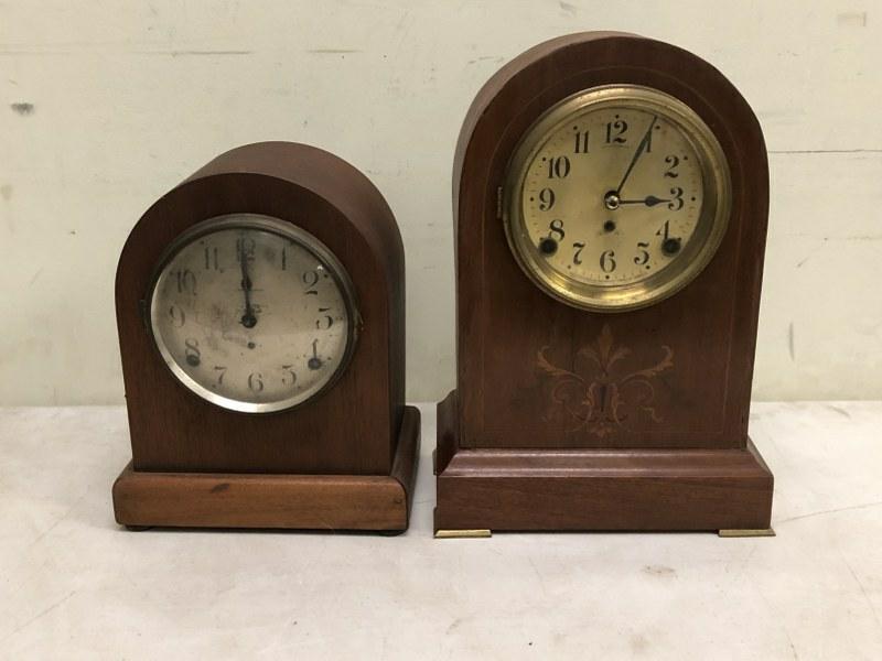 (2) TOMBSTONE SHAPED MANTEL CLOCKS, FROM OLD TIME: (2) TOMBSTONE SHAPED MANTEL CLOCKS, FROM OLD TIME REPAIRMAN'S SHOP, TALL ONE HAS NO BACK, BOTH WITH PENDULUMS, APPEAR TO BE RUNNING, BOTH ARE SETH THOMAS, TALL ONE HAS INLAY ON FRONT, BOTH MAHOGANY.