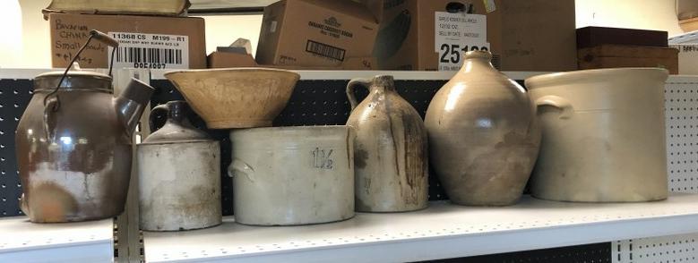 FARMHOUSE LOT OF AS FOUND STONEWARE JUGS AND CROCKS,: FARMHOUSE LOT OF AS FOUND STONEWARE JUGS AND CROCKS, WITH YELLOWARE BOWL, AS FOUND, DIRTY, CHIP ON OVOID NECK, AS PICTURED, HAIRLINE IN YELLOWARE BOWL.