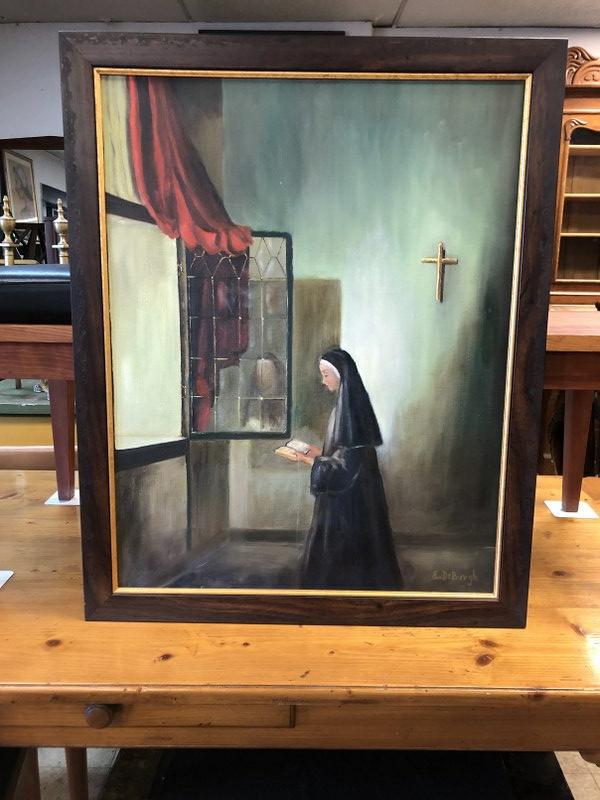 E. DEBURGH O/C NUN INSIDE CHURCH, READING BOOK, SIGNED: E. DEBURGH O/C NUN INSIDE CHURCH, READING BOOK, SIGNED LOWER LEFT, FROM CLOSED MONASTERY IN SANTA BARBARA, CALIFORNIA. PAINTING MEASURES 28" X 22". VERY NICE CONDITION.