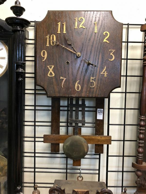 MISSION OAK WALL CLOCK, MEASURES 26" TOP TO BOTTOM. HAS: MISSION OAK WALL CLOCK, MEASURES 26" TOP TO BOTTOM. HAS KEY, APPEARS TO BE RUNNING. FROM SHOP OF OLD TIME CLOCK REPAIRMAN, WHO DID IT AS A SIDE LINE.