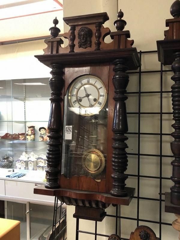 EARLY 27" HIGH WALL CLOCK, WINDS FREELY, HAS KEY AND: EARLY 27" HIGH WALL CLOCK, WINDS FREELY, HAS KEY AND PENDULUM, ONE COLUMN OFF FRONT, WILL RE GLUE BACK, OR LEAVE TO NEW OWNER, FROM SHOP OF OLD TIME CLOCK REPAIRMAN, WHO DID AS A SIDE LINE.