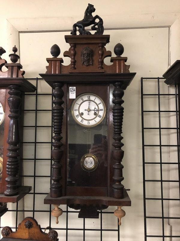 33" HIGH EARLY WALL CLOCK, FROM SHOP OF OLD TIME CLOCK: 33" HIGH EARLY WALL CLOCK, FROM SHOP OF OLD TIME CLOCK REPAIRMAN, WHO DID IT AS A SIDE LINE. I THINK THE TOP CERAMIC HORSE WAS ADDED ON BY HIM AT SOMETIME, AND SOME REPLACED FINIALS, FACE IS NICE, HAS