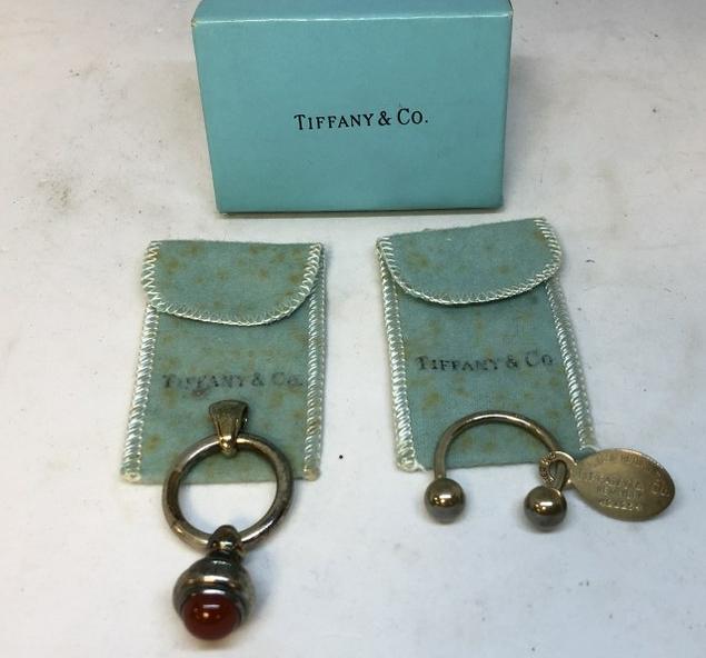 (2) TIFFANY STERLING PCS. INCL. PENDANT MARKED T & CO.: (2) TIFFANY STERLING PCS. INCL. PENDANT MARKED T & CO. AND KEY RING CHARM, FROM LOCAL ESTATE, WITH CLOTH BAGS, AND A BOX.