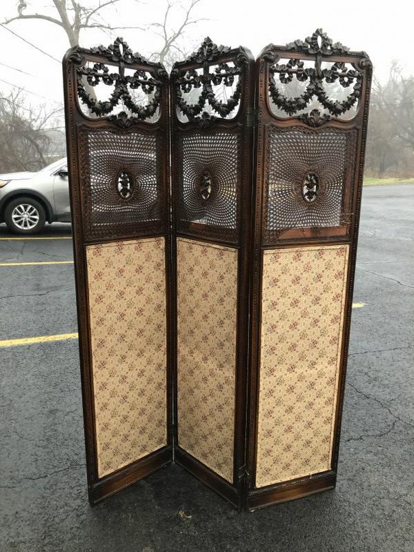 DECORATIVE 3 PANEL OLDER SCREEN, UNSURE OF ORIGIN, SOME: DECORATIVE 3 PANEL OLDER SCREEN, UNSURE OF ORIGIN, SOME OF THE CANING HAS TEARS, EACH PANEL MEASURES 69.5" X 16", WONDERFUL CARVING ON TOPS, FROM NICE DUTCHESS COUNTY HOME.