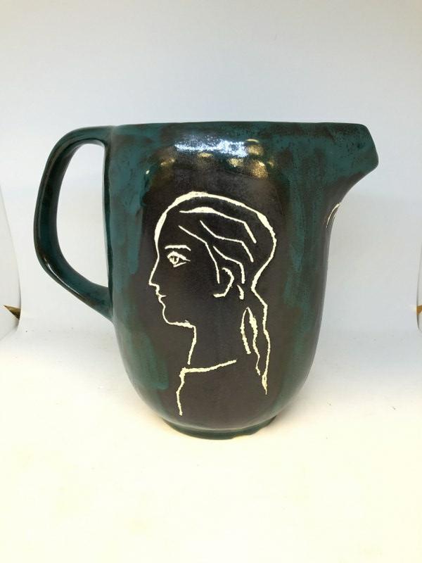 ALFREDO ZALCE (1908-2003) ART POTTERY PITCHER WITH 3: ALFREDO ZALCE (1908-2003) ART POTTERY PITCHER WITH 3 FACES, UNSIGNED, (2) SMALL BOTTOM RIM SURFACE CHIPS AS PICTURED. MEASURES 7.75" HIGH. ALFREDO ZALCE (1908-2003), CONTEMPORARY OF DIEGO RIVERA, AND