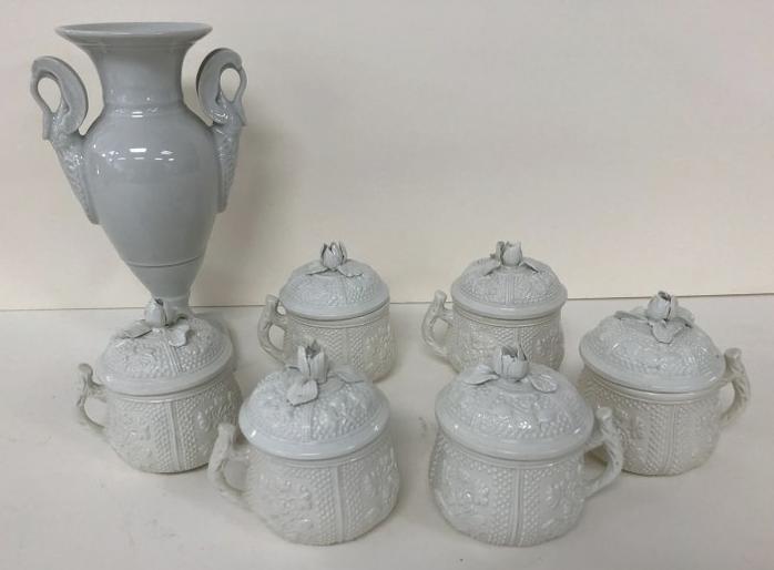 PORCELAIN LOT INCL. 6 MATCHING SMALL HANDLED CUPS WITH: PORCELAIN LOT INCL. 6 MATCHING SMALL HANDLED CUPS WITH FLORAL DECORATED LIDS, MARKED MADE IN ITALY, ALL IN EXCELLENT ESTATE CONDITION, AND LIMOGES VASE WITH SWAN HANDLES. VASE MEASURES 8" HIGH, THE CU