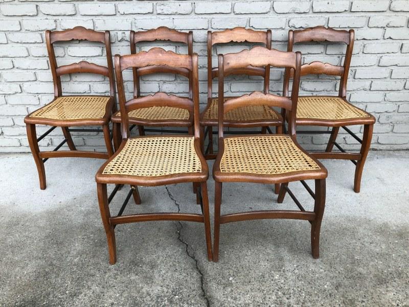 (6) CIRCA 1900 WALNUT CANED SEAT CHAIRS, MADE AT: (6) CIRCA 1900 WALNUT CANED SEAT CHAIRS, MADE AT CHICHESTER CHAIR FACTORY, CANE ALL GOOD, ONE CHAIR HAS SMALLER DENT IN CANE. FROM LOCAL ESTATE.