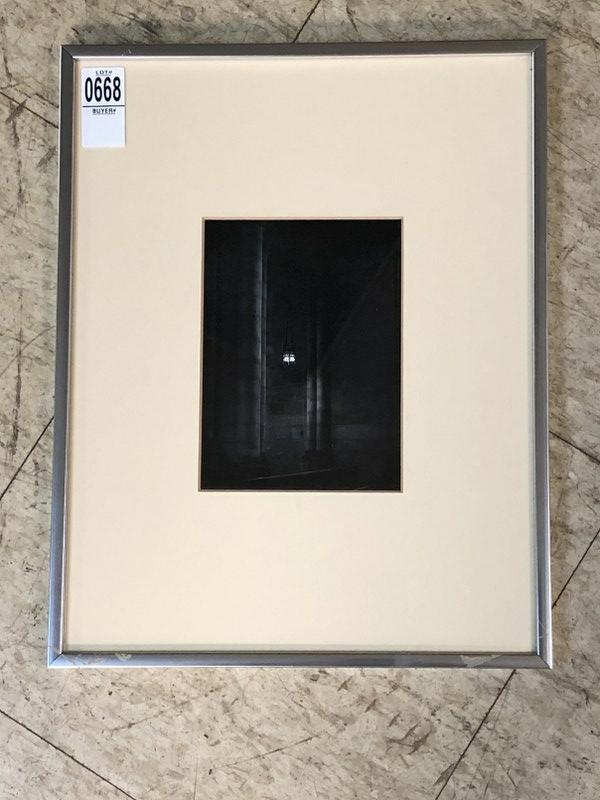 TOM MILLEA (1944-2015 ) B & W PHOTOGRAPH COLUMNS WITH: TOM MILLEA (1944-2015 ) B & W PHOTOGRAPH COLUMNS WITH HANGING LIGHT, INSCRIBED ON BACK TO LEGENDARY PHOTOGRAPHER PHIL TRAGER . IMAGE MEASURES 6.5" X 5", FRAME SIZE 14" X 11". FROM EVELYNE DAITZ ESTATE