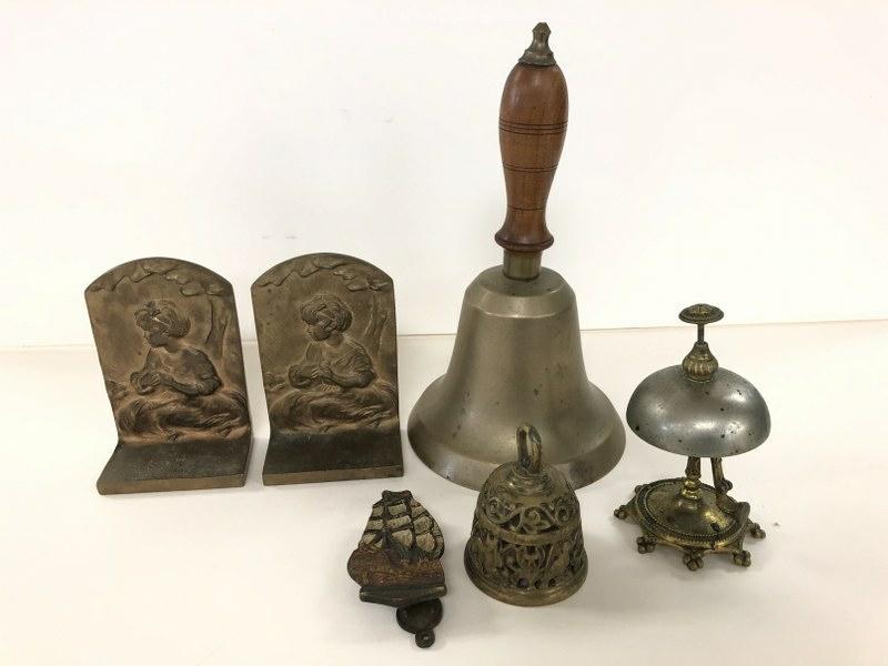MISC. BRASS LOT INCL. 3 BELLS, BRONZE BOOKENDS WITH: MISC. BRASS LOT INCL. 3 BELLS, BRONZE BOOKENDS WITH NOUVEAU WOMAN ON FRONTS AND OLD SCHOOL BELL. NICE OLD LOT.