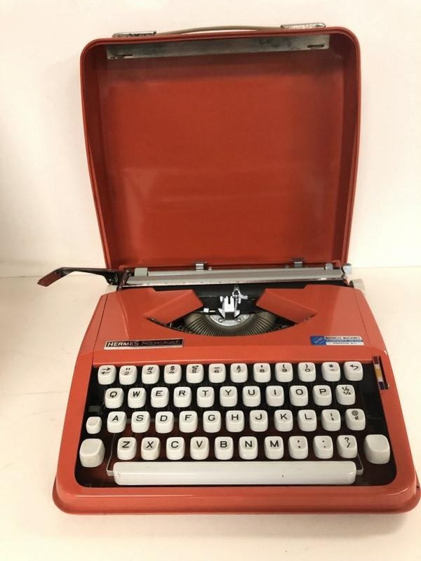 HERMES ROCKET ORANGE (HARD TO FIND COLOR) SMALL: HERMES ROCKET ORANGE (HARD TO FIND COLOR) SMALL TYPEWRITER, MID CENTURY ERA, IN WONDERFUL ESTATE CONDITION, FROM LOCAL ESTATE, CASE AND BODY CLEAN, AND ALWAYS WELL TAKEN CARE OF AND MAINTAINED, AS YOU
