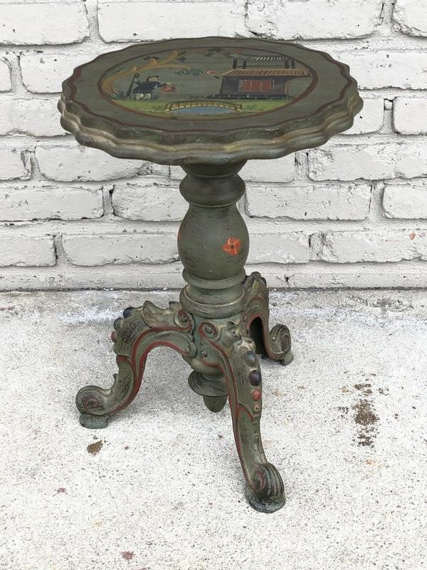 GREAT FOLK ART SMALL HAND PAINTED STAND, WITH IRON: GREAT FOLK ART SMALL HAND PAINTED STAND, WITH IRON LEGS. PROBABLY ORIGINALLY AN ORGAN STOOL, HAS ASIAN LANDSCAPE SCENE PAINTED ON TOP WITH FIGURE HOLDING A BASKET IN ONE HAND, AND STAFF IN OTHER HAND.