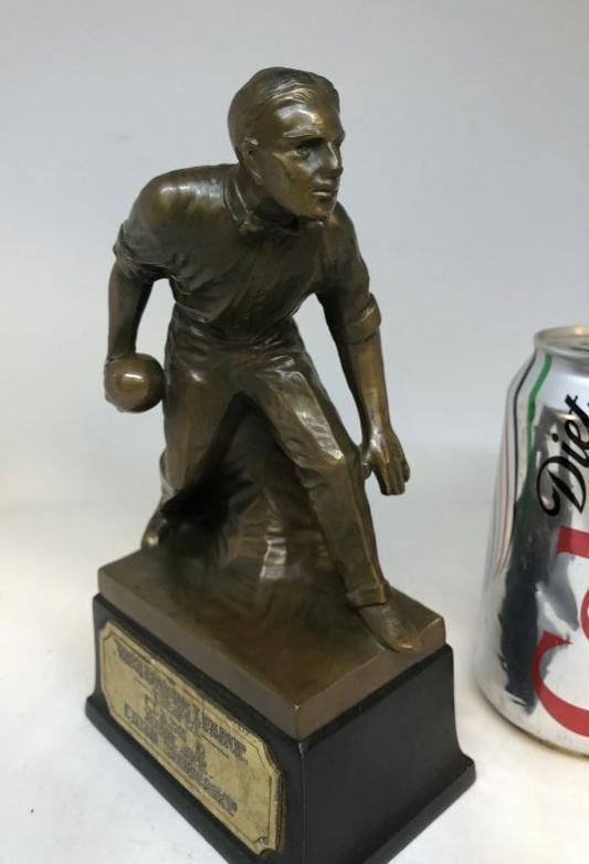 REALLY COOL 1930 BOWLING TROPHY, WITH MAN WEARING A BOW: REALLY COOL 1930 BOWLING TROPHY, WITH MAN WEARING A BOW TIE, BRONZE COATED, IN EXCELLENT CONDITION, MEASURES 7.5" HIGH. FROM LOCAL ESTATE.