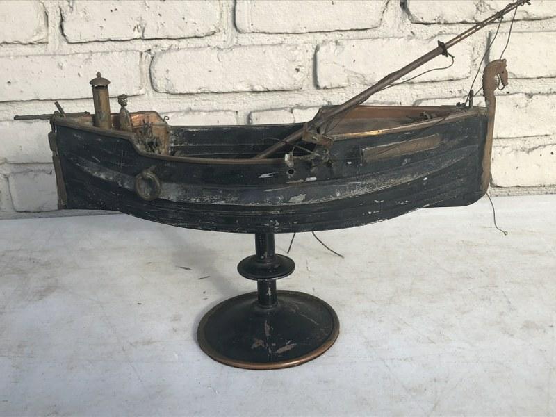 CIRCA 1900 FOLK ART METAL & COPPER SAIL BOAT, WITH: CIRCA 1900 FOLK ART METAL & COPPER SAIL BOAT, WITH BRASS TAG (LEIF ERIKSON), POLE THAT HOLDS SAILS IS NOT ATTACHED, BUT THERE. THIS COMES FROM A BROOKLYN, N.Y. ESTATE, ON A PEDESTAL BASE, HAS CAPTAIN 