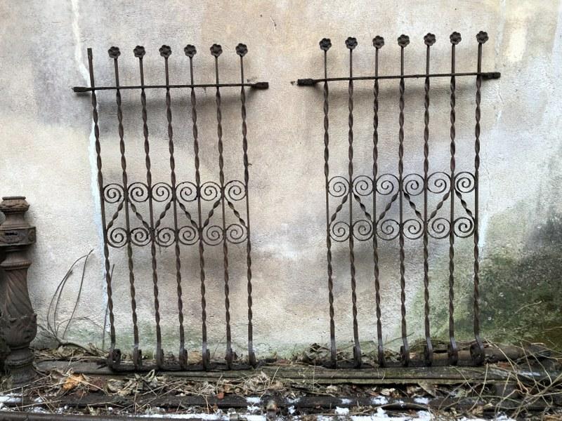 PR. IRON VICTORIAN WINDOW GUARDS FROM BROOKLYN, N.Y.: PR. IRON VICTORIAN WINDOW GUARDS FROM BROOKLYN, N.Y. HOARD OF ARCHITECTURAL IRON, MEASURE 61.25" X 36 3/8". MISSING ONE FLOWER ON TOP. GOOD OVERALL CONDITION, FOR SITTING IN YARD FOR 40 PLUS YEARS.