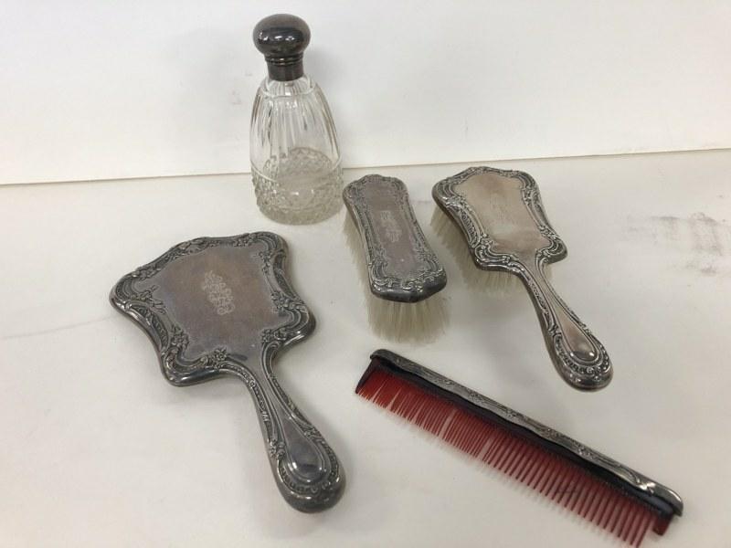 GORHAM STERLING SILVER LADIES 4 PC. VANITY SET, PLUS: GORHAM STERLING SILVER LADIES 4 PC. VANITY SET, PLUS CUT CRYSTAL COLOGNE DECANTER WITH STERLING LID (SMALL DENT ON LID), MEASURES 6" HIGH, ALL IN VERY GOOD ESTATE CONDITION. THE 2 BRUSHES & HAND MIRRO