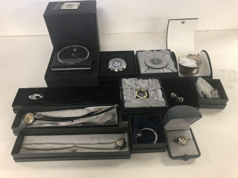 MOVADO LOT OF JEWELRY STILL IN ORIGINAL BOXES, FROM: MOVADO LOT OF JEWELRY STILL IN ORIGINAL BOXES, FROM LOCAL ESTATE, INCLUDES CLOCKS, STERLING & 18K RING WITH DIAMOND CHIP, STERLING & 18K NECKLACE WITH DIAMOND CHIP, ETC. AND OTHER STERLING PCS. INCL.