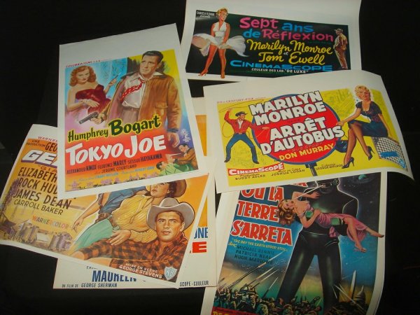 25 OLDER BELGIAN REPRINT MOVIE POSTERS INCLUDING: 25 OLDER BELGIAN REPRINT MOVIE POSTERS INCLUDING MARILYN MONROE IN BUS STOP & SEVEN YEAR ITCH, JAMES DEAN IN GIANT, JOHN WAYNE IN RIO GRANDE & SANDS OF IWO JIMA, THE DAY THE EARTH STOOD STILL, ABOTT &