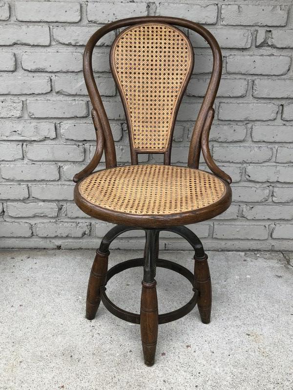 BENTWOOD SWIVEL SEAT DESK CHAIR, CANE SEAT AND BACK ARE: BENTWOOD SWIVEL SEAT DESK CHAIR, CANE SEAT AND BACK ARE INTACT, GREAT IRON LEGS AND BASE, PROBABLY THONET