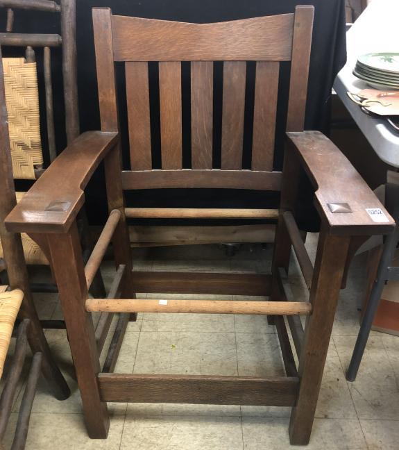 GUSTAV STICKLEY # 312 V-BACK ARMCHAIR: GUSTAV STICKLEY # 312 V-BACK ARMCHAIR 36”h, seat: 20 1/2” wide at back, 17 3/4”d Features & Markings: The specimen is entirely typical of the form as shown in the catalogs. It has a 1 1/2” ang