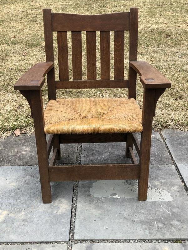 GUSTAV STICKLEY #312 V-BACK ARMCHAIR WITH RUSH SEAT.: GUSTAV STICKLEY #312 V-BACK ARMCHAIR WITH RUSH SEAT. 36" H, SEAT: 20 1/2 WIDE AT BACK, 17 3/4"DRush or leather seat version with round seat rails Features & Markings: The specimen is entirely typical 