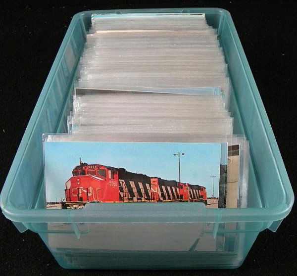 BIG LOT OF TRAIN POSTCARDS ALL IN PLASTIC SLEEVES.: BIG LOT OF TRAIN POSTCARDS ALL IN PLASTIC SLEEVES. MY GUESS IS MOST FROM 1960'S ERA, SOME A LITTLE EARLIER. GOOD DEALER LOT.