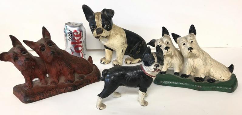 (4) VINTAGE IRON DOG DOORSTOPS, FROM ESTATE IN: (4) VINTAGE IRON DOG DOORSTOPS, FROM ESTATE IN PROVIDENCE RI, INCLUDES RED PAONTED DOUBLE SCOTTIES 8.5" LONG, WHITE DOUBLE SCOTTIES 8" LONG, SEATED BLACK & WHITE DOG 7.5" HIGH & SMALL BOSTON TERRIER 5