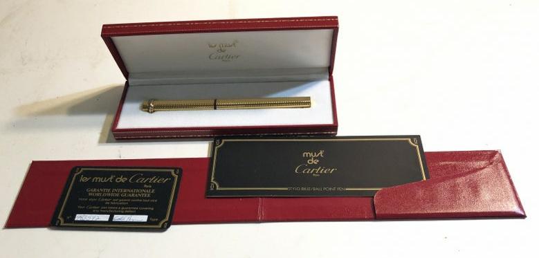 CARTIER GOLD FILLED BALL POINT PEN, IN ORIGINAL BOX,: CARTIER GOLD FILLED BALL POINT PEN, IN ORIGINAL BOX, PAPERWORK & CARD. FROM LOCAL ESTATE OF WOMAN, WHOS MOTHER GAVE TO HER YEARS AGO. WAS KEPT IN SAFETY DEPOSIT BOX TILL NOWâ€¦