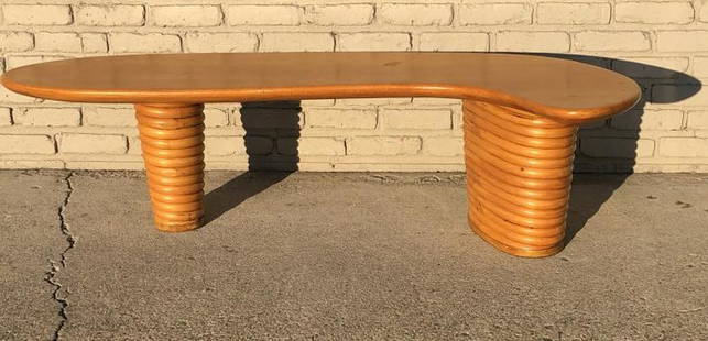 PAUL FRANKL HARD TO FIND RATTAN BOOMERANG COFFEE TABLE,: PAUL FRANKL HARD TO FIND RATTAN BOOMERANG COFFEE TABLE, IN VERY CLEAN CONDITION, NO ISSUES. FROM GOOD LOCAL ESTATE, MEASURES 61" LONG X 16" HIGH. YOU WON'T BE DISAPPOINTED WITH THIS ONE!