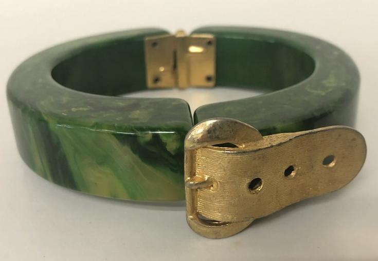BAKELITE (1) BRACELET WITH BELT LIKE BUCKLE, FROM A: BAKELITE (1) BRACELET WITH BELT LIKE BUCKLE, FROM A ONE OWNER BROOKLYN, N.Y. ESTATE COLLECTION. THIS COLLECTION WAS HER PERSONAL AND INVENTORY FROM THE NYC FLEA MARKETS SHE DID IN HE 1970'S. THIS IS F