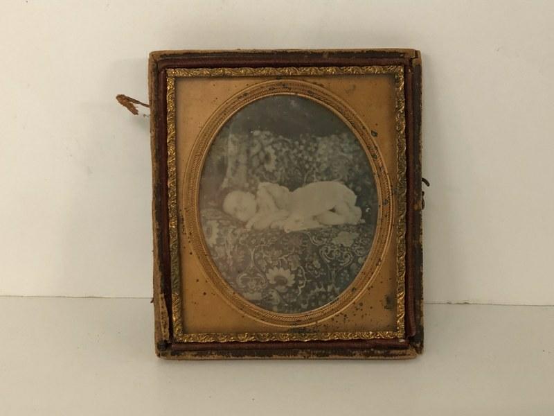 POSTMORTEM DAGUERREOTYPE OF YOUNG CHILD LAYING ON (1 of 2)